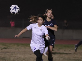 Lysaundra Aquino keeps her eye on the ball in Friday's win over Central Valley Christian.